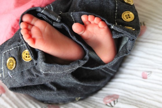 Audrey's feet in jeans